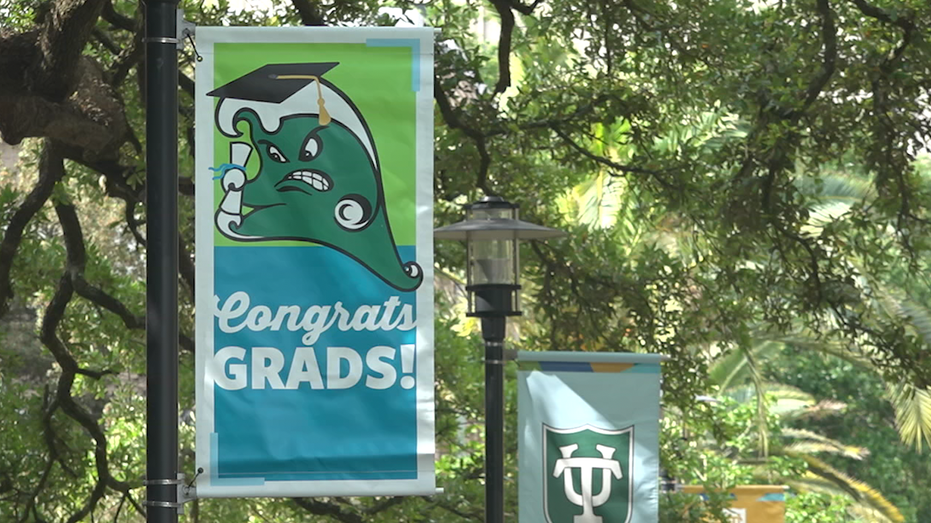 Flag that reads "Congrats Grads" on Tulane University's campus