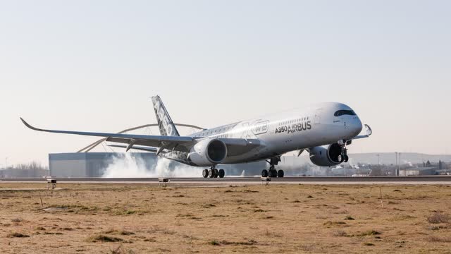 This image shows the Airbus A350 airplane on the runway.