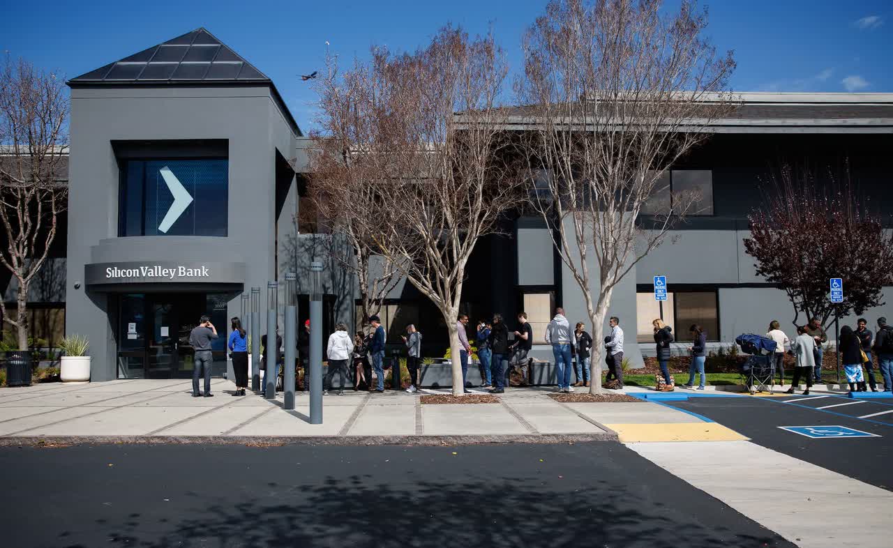 A picture of a queue in front of a Silicon Valley Bank Office